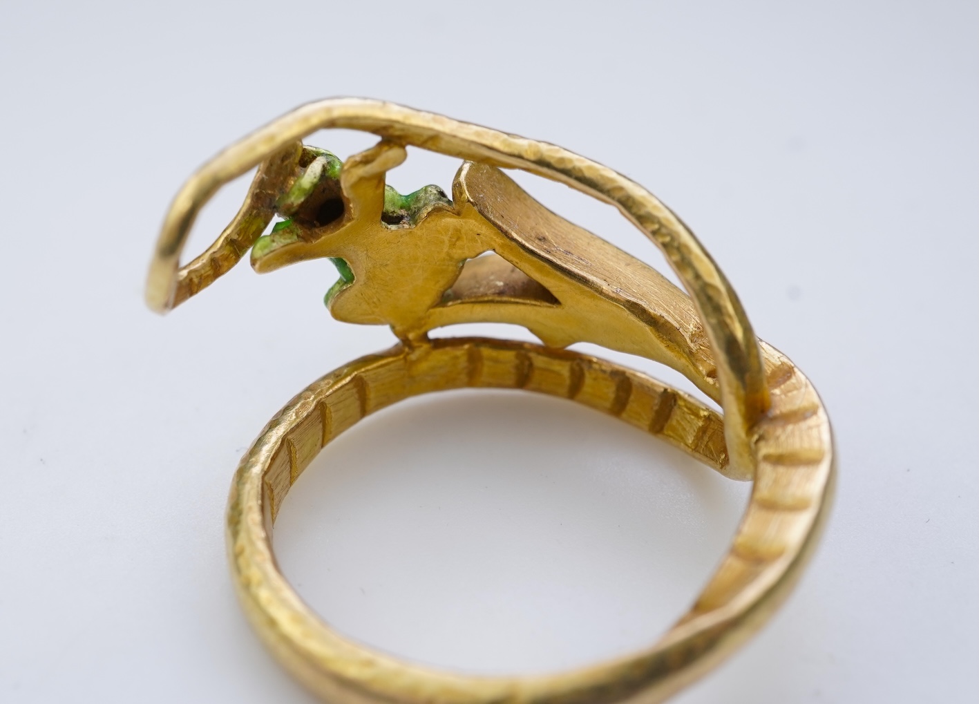 An unusual gold and enamel novelty ring